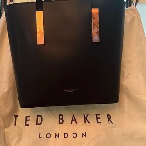 Authentic Ted Baker London bucket bag with small wristlet inside.